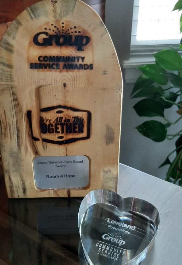 A wooden box with the words " together " on it.